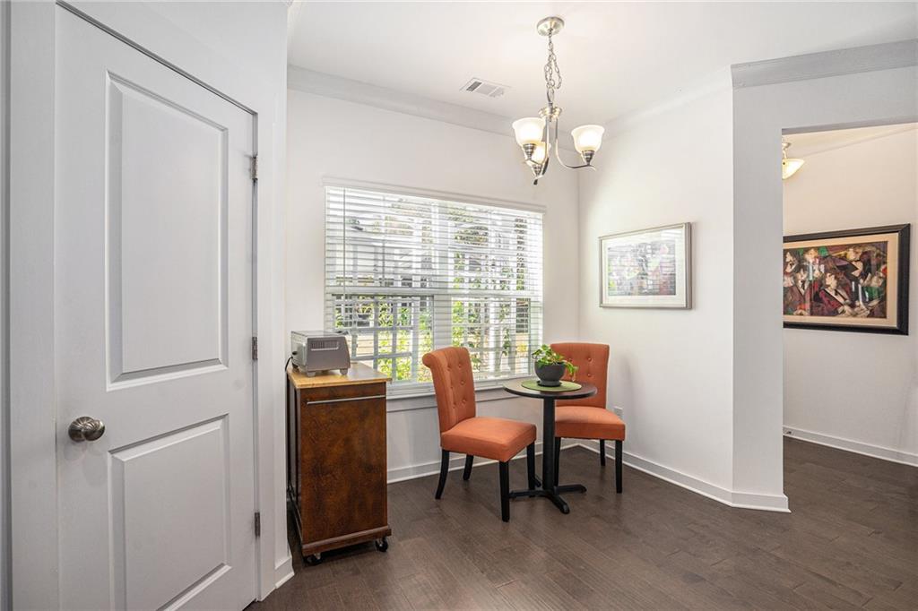 2473 Rathburn Circle Loganville, GA 30052 - Photo 13 of 32 a dining room with furniture and windows