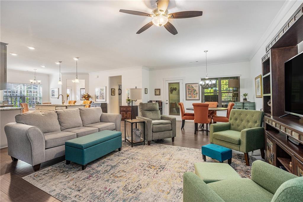 2473 Rathburn Circle Loganville, GA 30052 - Photo 2 of 32 a living room with furniture kitchen view and a large window