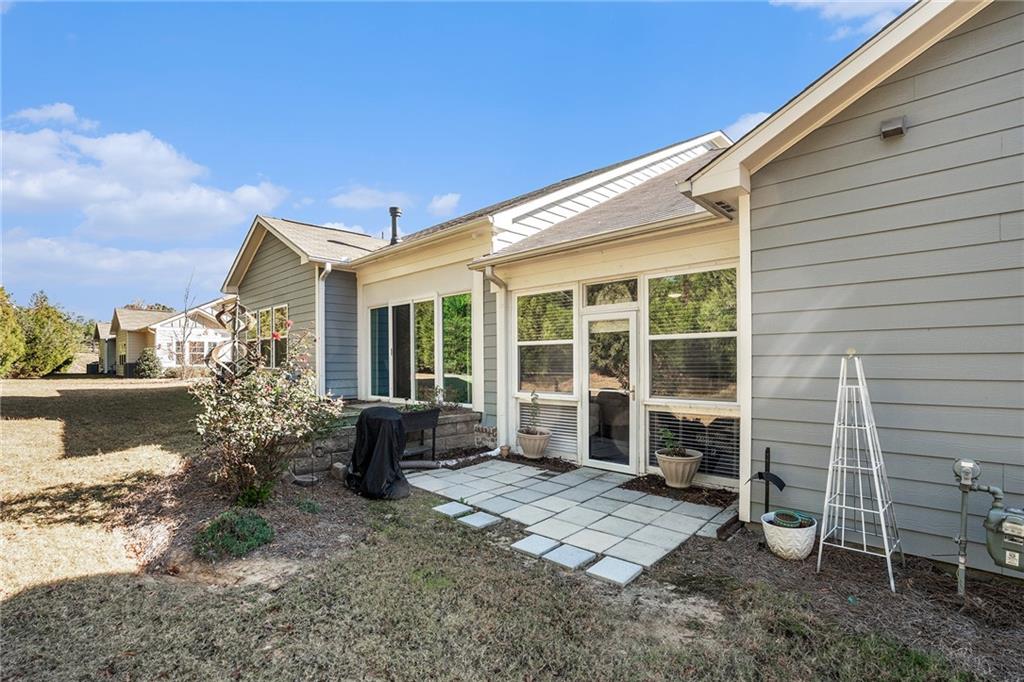 2473 Rathburn Circle Loganville, GA 30052 - Photo 29 of 32 a front view of a house with garden