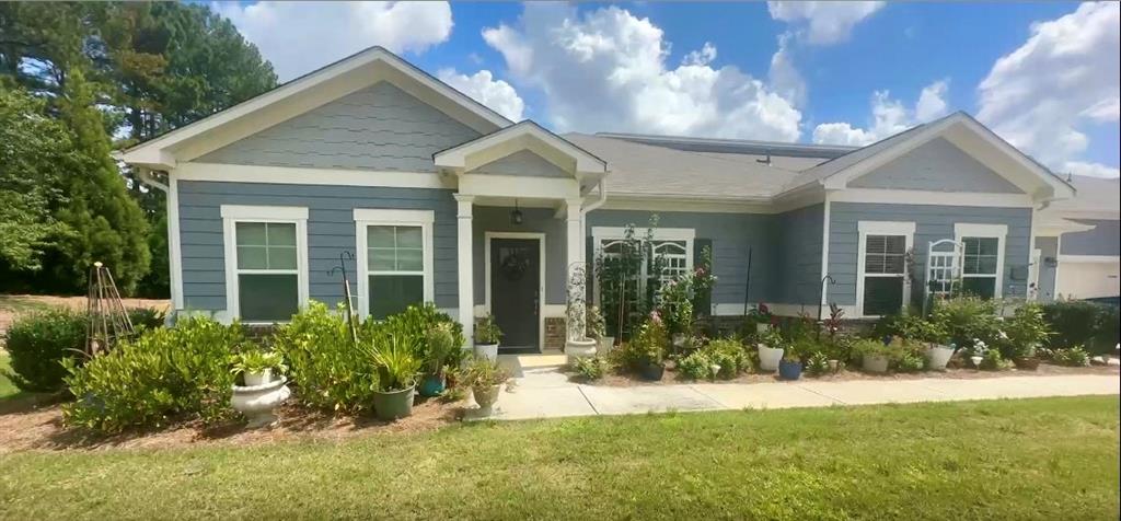 2473 Rathburn Circle Loganville, GA 30052 - Photo 32 of 32 front view of a house with a yard