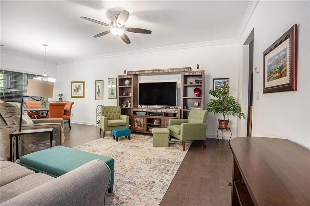2473 Rathburn Circle Loganville, GA 30052 - Photo 8 of 32 a living room with furniture and a flat screen tv
