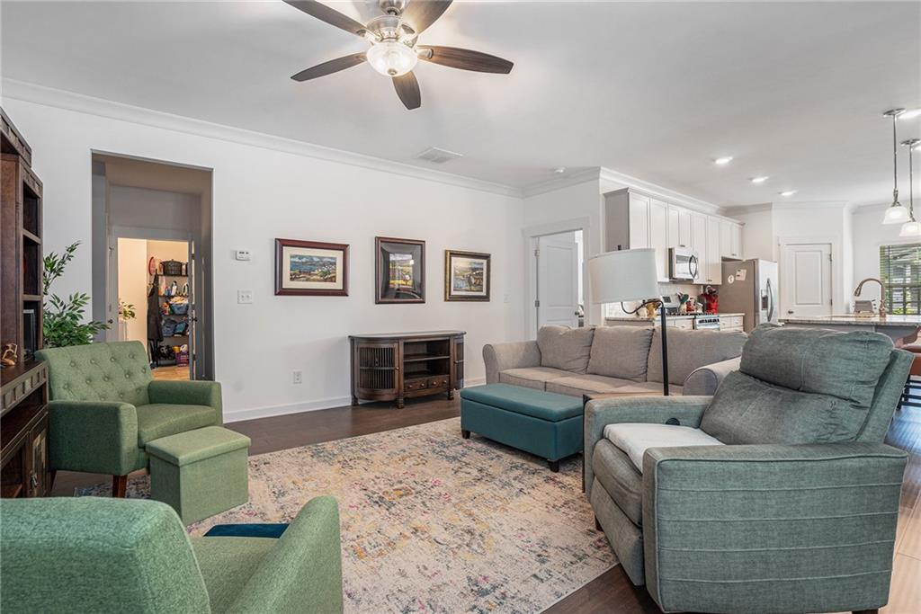 2473 Rathburn Circle Loganville, GA 30052 - Photo 9 of 32 a living room with furniture and a fireplace