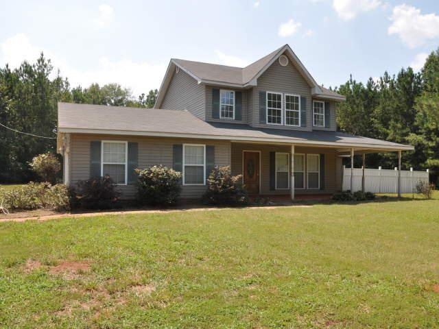 667 Hood Road Concord, GA 30206 - Photo 1 of 1 a front view of a house with a yard