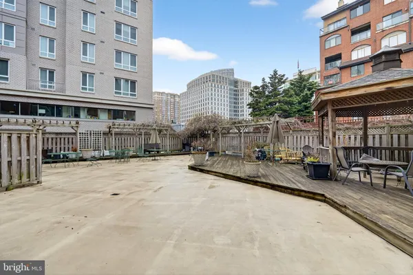 a view of roof with building in the back