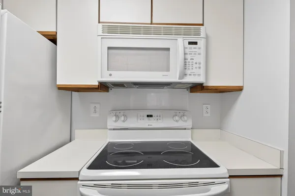 a kitchen with a stove and a microwave