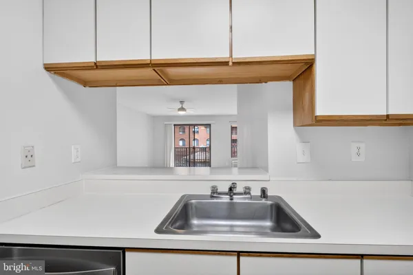 a kitchen with a sink and cabinets