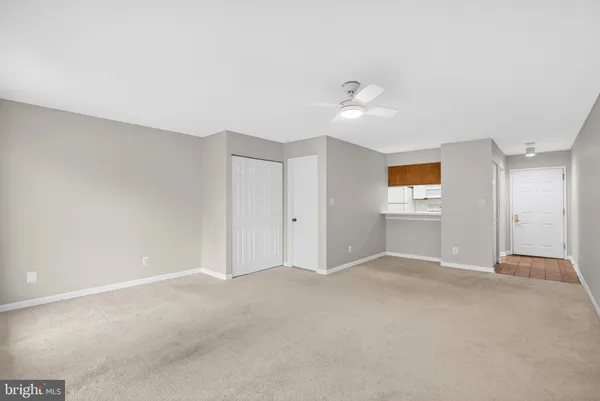 an empty room with a empty space and windows