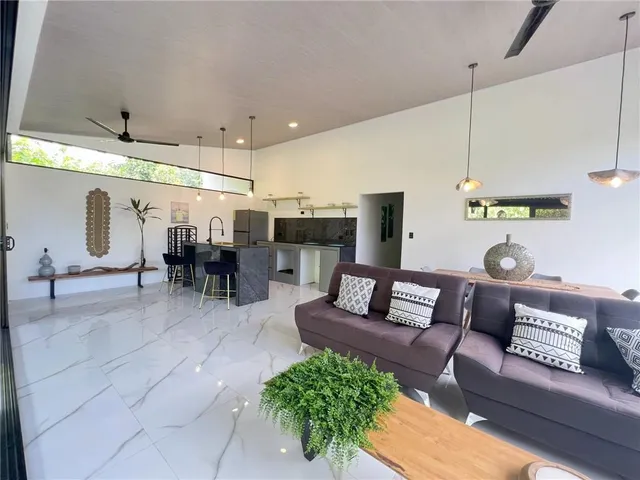 a living room with furniture and a table