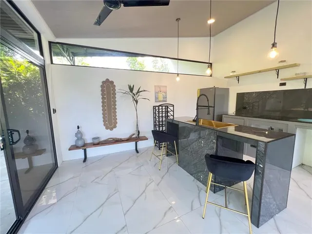 a living room with a table or chairs and a wooden floor