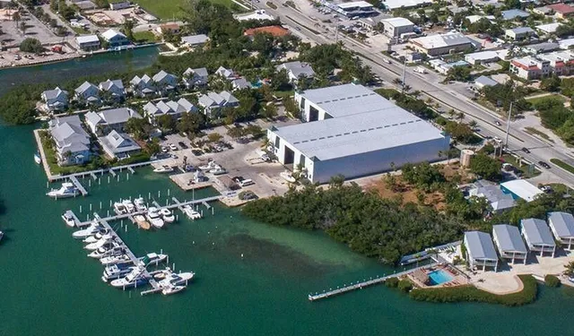 an aerial view of a house with a lake view