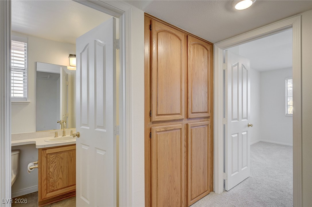 2955 El Camino Road Las Vegas, NV 89146 - Photo 69 of 99 Corridor featuring baseboards and light colored carpet