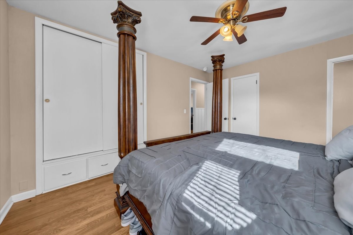 902 Sycamore Drive Manchester, TN 37355 - Photo 28 of 56 a bedroom with a bed and a chandelier