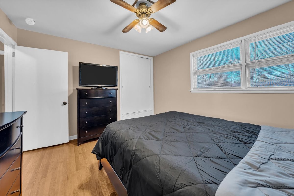 902 Sycamore Drive Manchester, TN 37355 - Photo 30 of 51 a bedroom with a bed and a flat tv screen on dresser