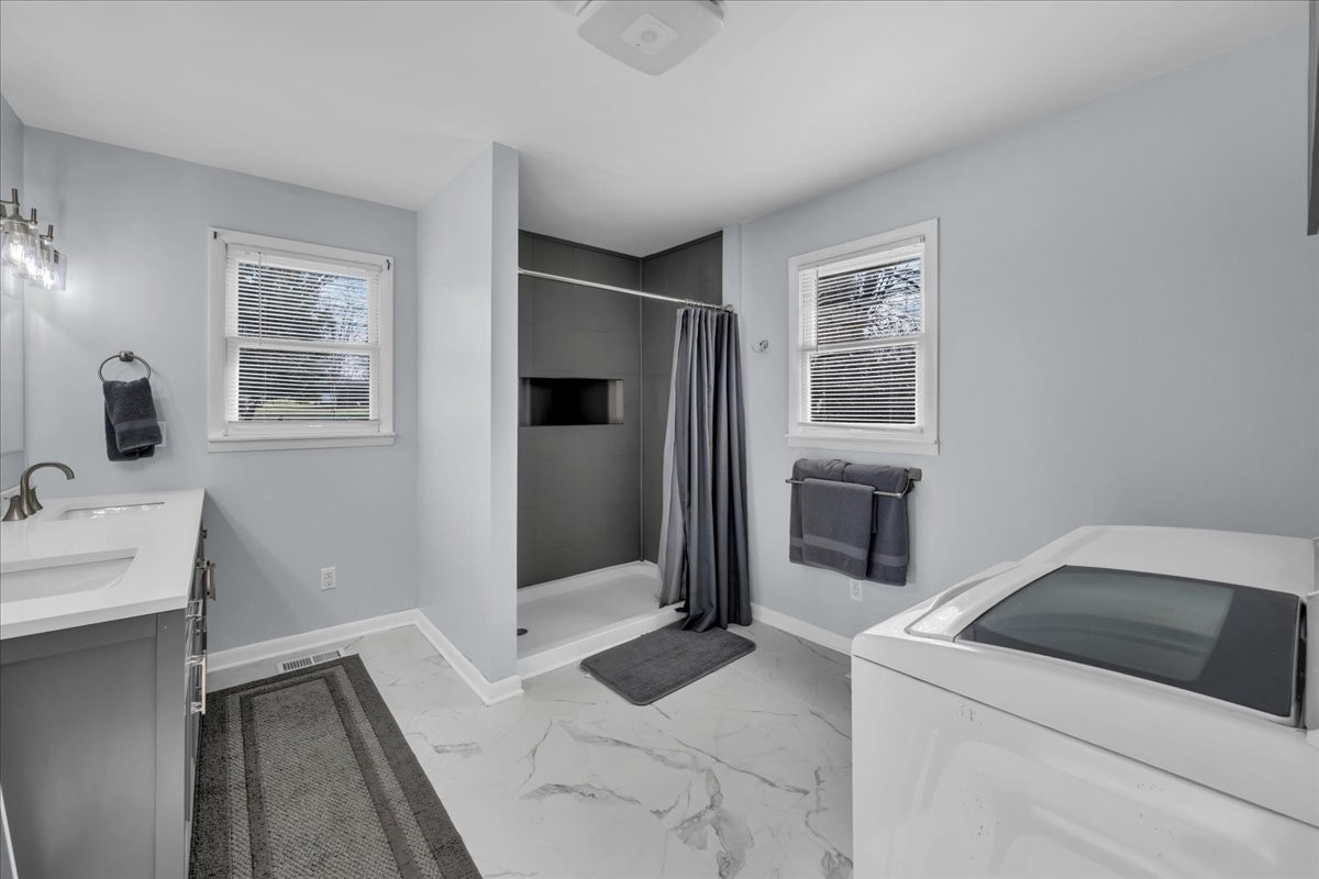 902 Sycamore Drive Manchester, TN 37355 - Photo 30 of 56 a bedroom with a bed and a refrigerator