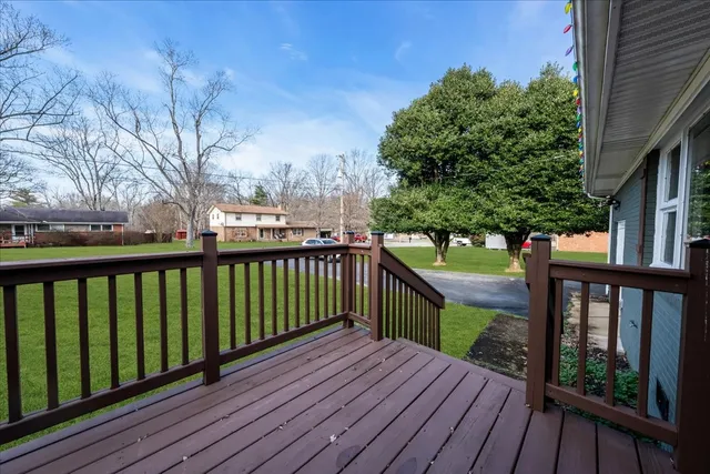 a view of wooden deck and a garden