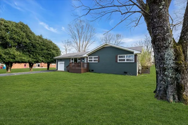 a view of a house with a yard