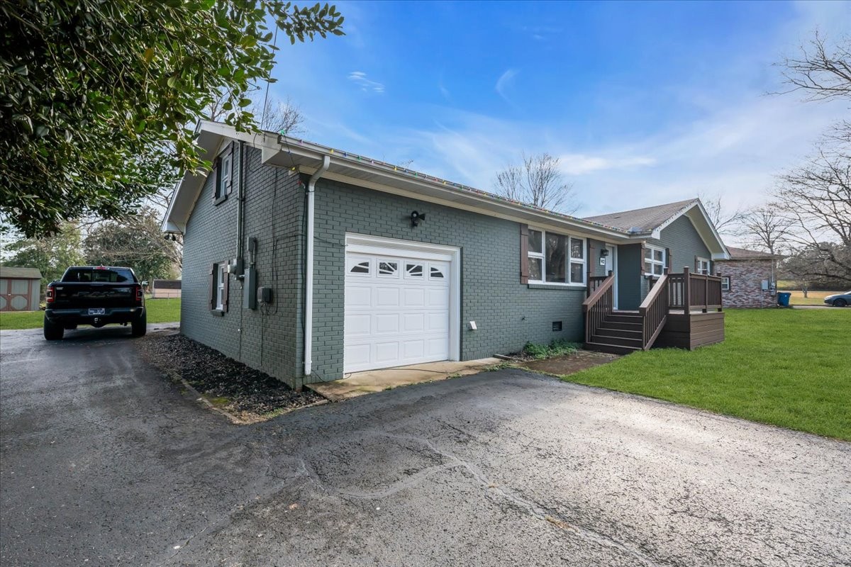 902 Sycamore Drive Manchester, TN 37355 - Photo 41 of 56 a view of a car parked in front of a house