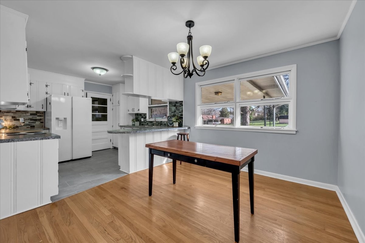 902 Sycamore Drive Manchester, TN 37355 - Photo 9 of 51 a view of a kitchen with cabinets and wooden floor