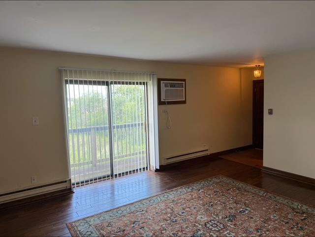 3360 West 184th Street, Unit 3W Homewood, IL 60430 - Photo 4 of 16 a view of an empty room with wooden floor and a window