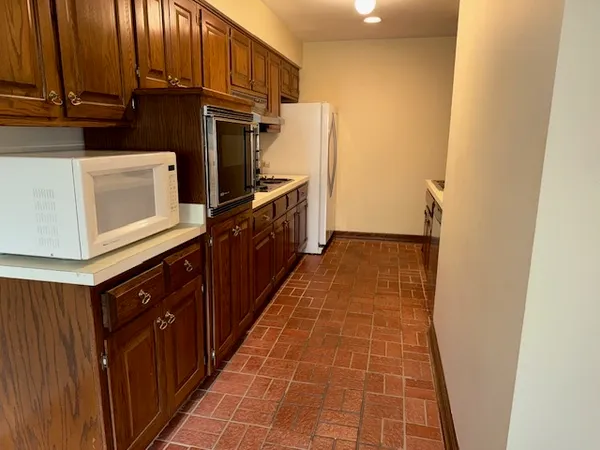 a kitchen with stainless steel appliances a refrigerator and a stove