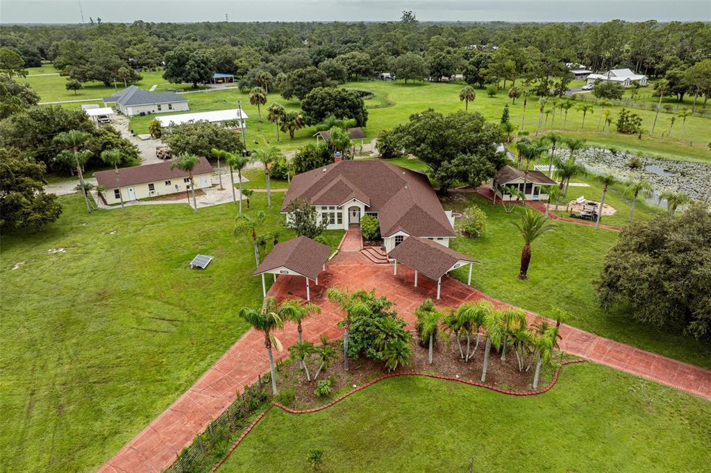1389 Ivan Boulevard LaBelle, FL 33935 - Photo 1 of 1 an aerial view of a houses with outdoor space and street view