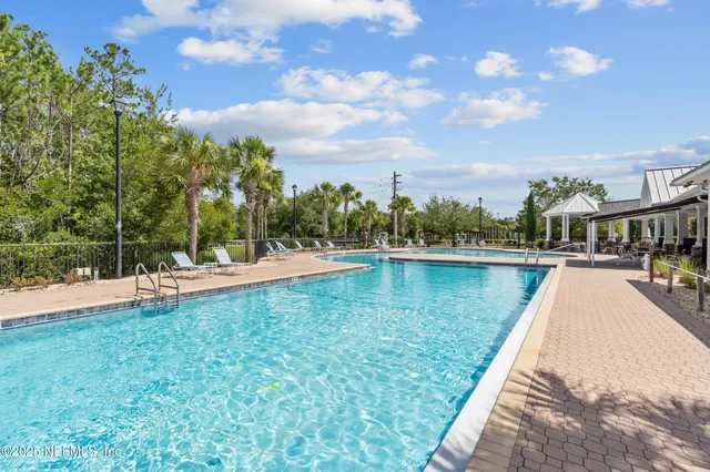 a view of swimming pool with a yard