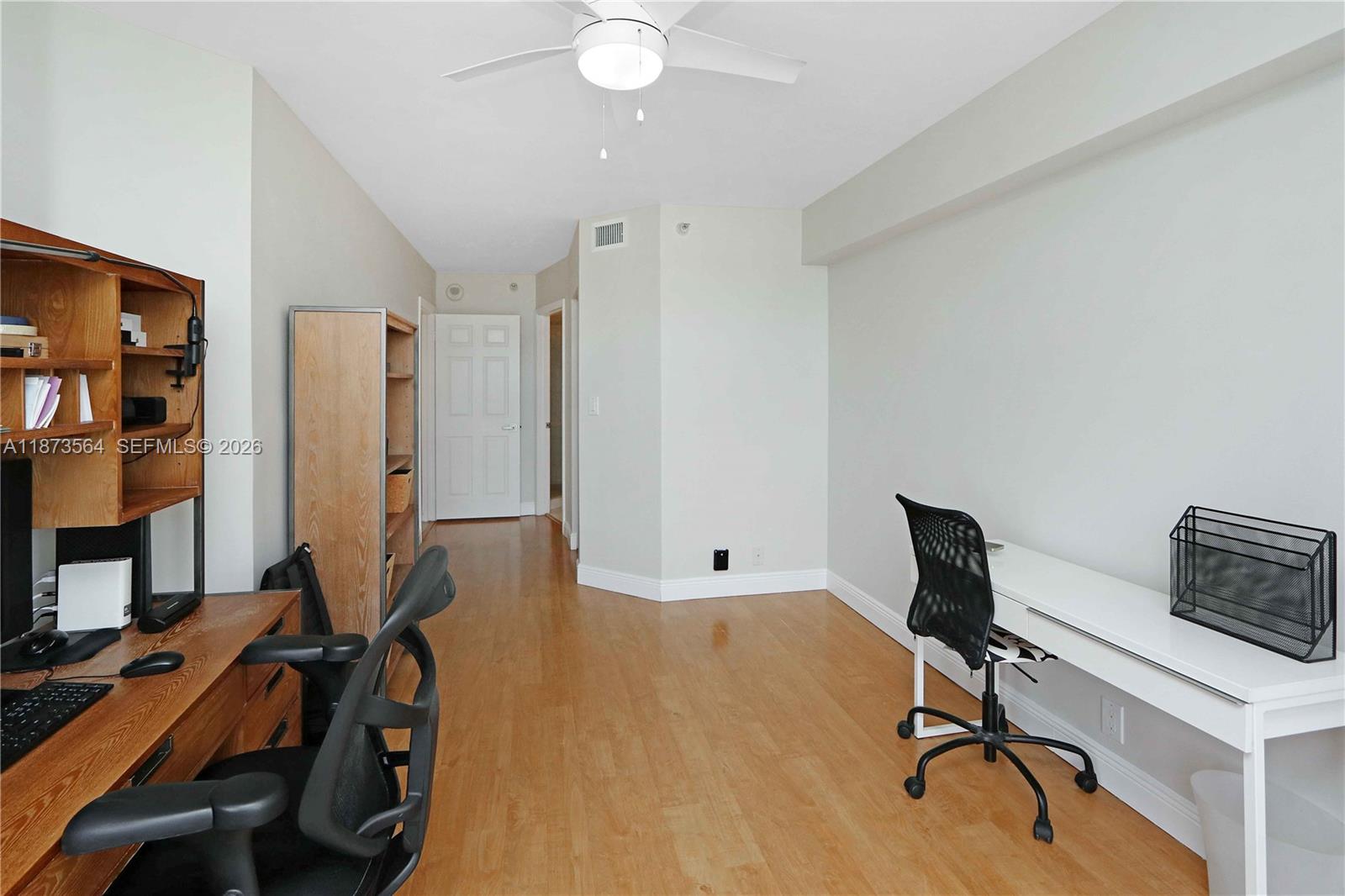 3530 Mystic Pointe Drive, Unit 2402 Aventura, FL 33180 - Photo 6 of 31 a view of a workspace with furniture and a window