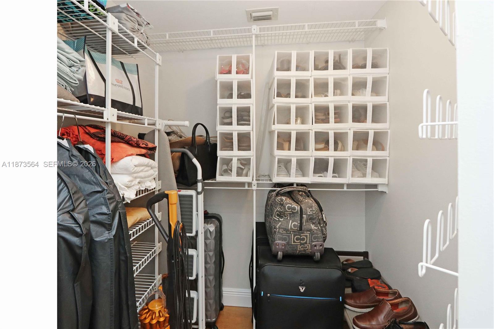 3530 Mystic Pointe Drive, Unit 2402 Aventura, FL 33180 - Photo 7 of 31 a view of a closet with storage and utility room