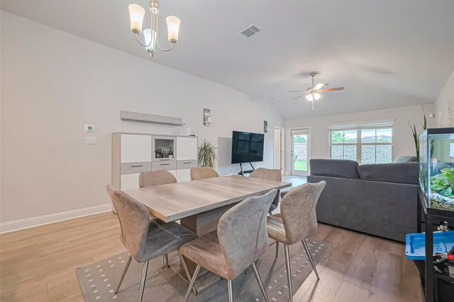 a view of a dining room with furniture and a livingroom