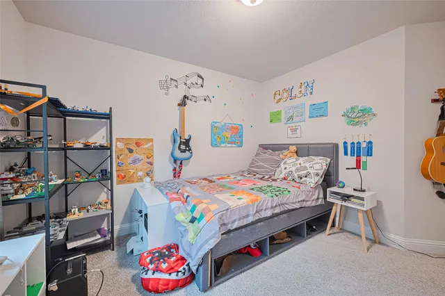 a bedroom with toys and a couch