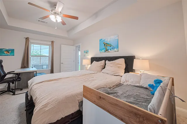 a bedroom with a bed and window