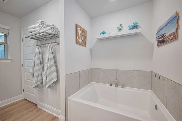 a bathroom with a bathtub and a shower