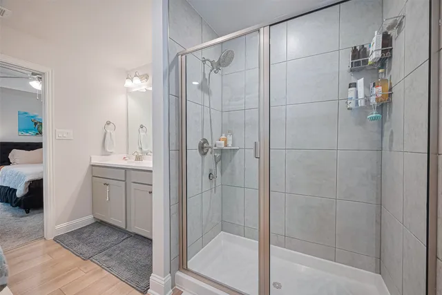 a bathroom with a shower and a sink