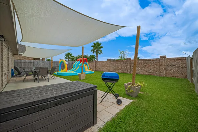 a room with pool table and chairs