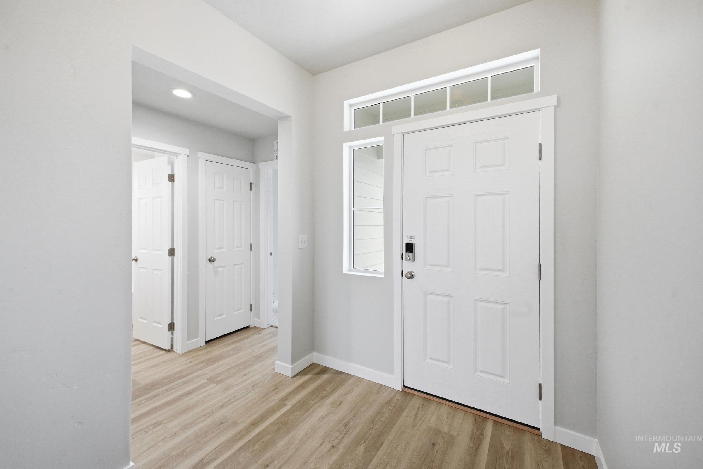 1598 Sunday River Street Middleton, ID 83644 - Photo 2 of 17 Entryway featuring a six-panel door, transom window, and a sidelight