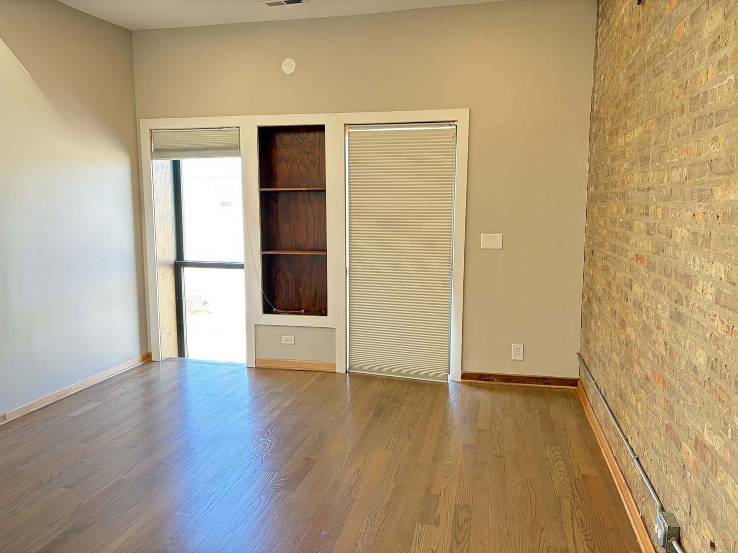 2727 South Archer Avenue, Unit 2 Chicago, IL 60608 - Photo 4 of 7 a view of an empty room with wooden floor