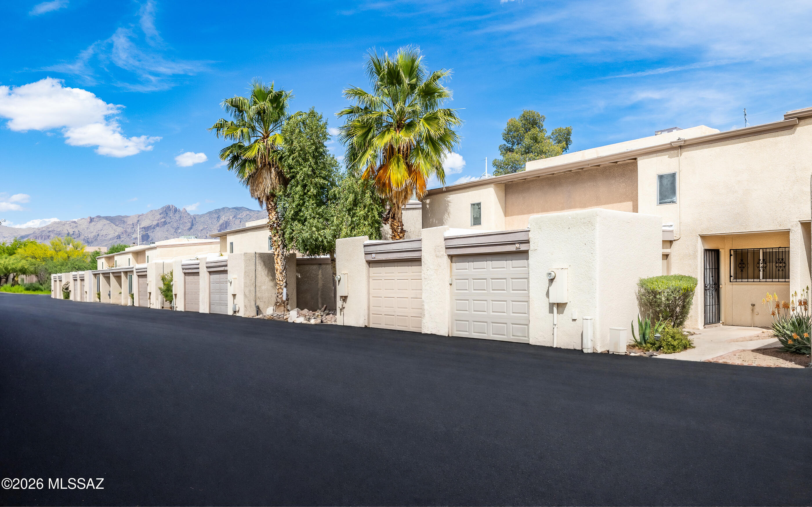 3750 North Country Club Road, Unit 46 Tucson, AZ 85716 - Photo 2 of 34 a front view of a house with a road