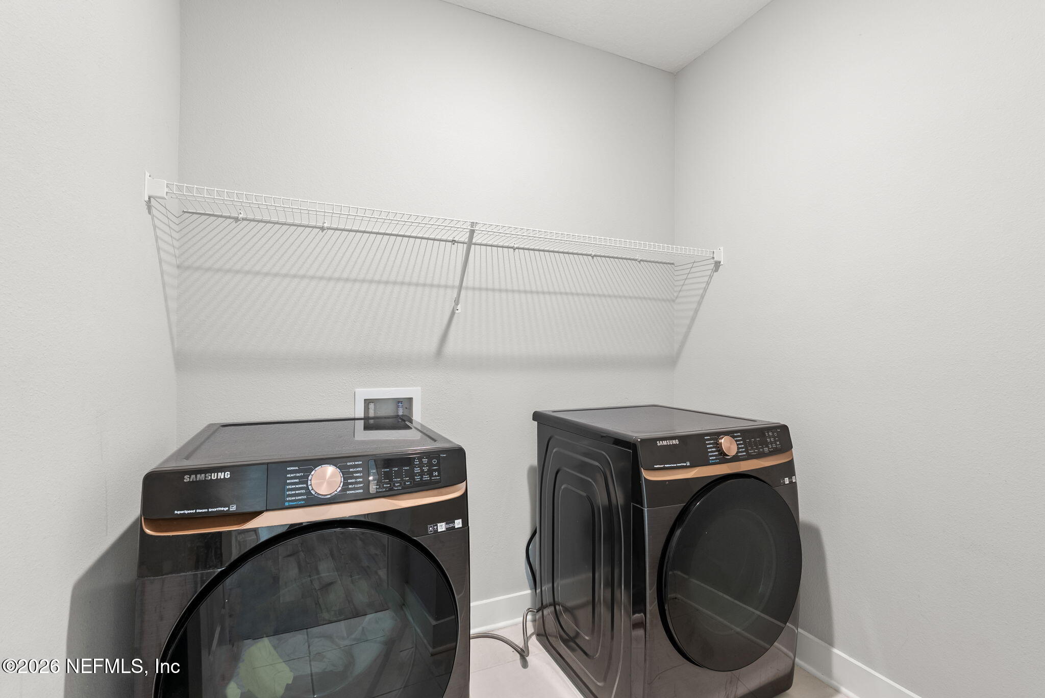 9989 Element Road Jacksonville, FL 32256 - Photo 20 of 58 a utility room with dryer and washer