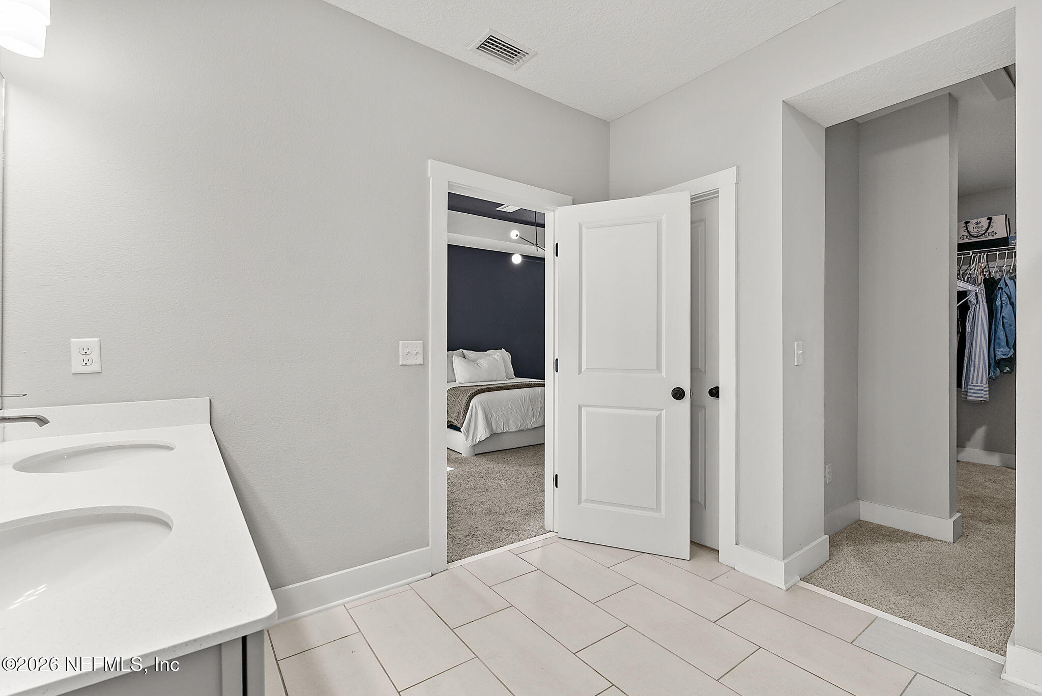 9989 Element Road Jacksonville, FL 32256 - Photo 27 of 58 a bathroom with a sink toilet and shower