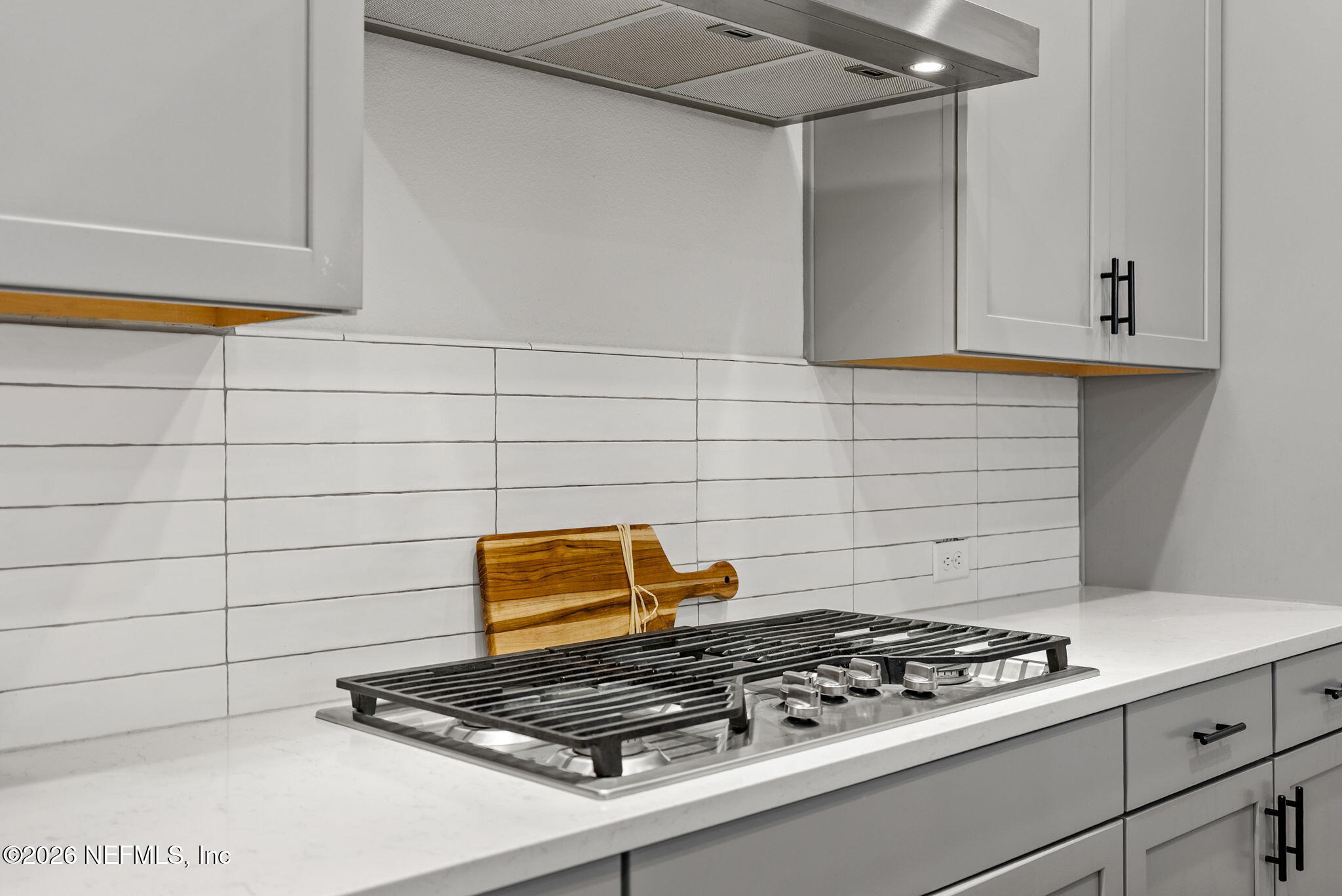 9989 Element Road Jacksonville, FL 32256 - Photo 10 of 58 a stove top oven sitting inside of a kitchen