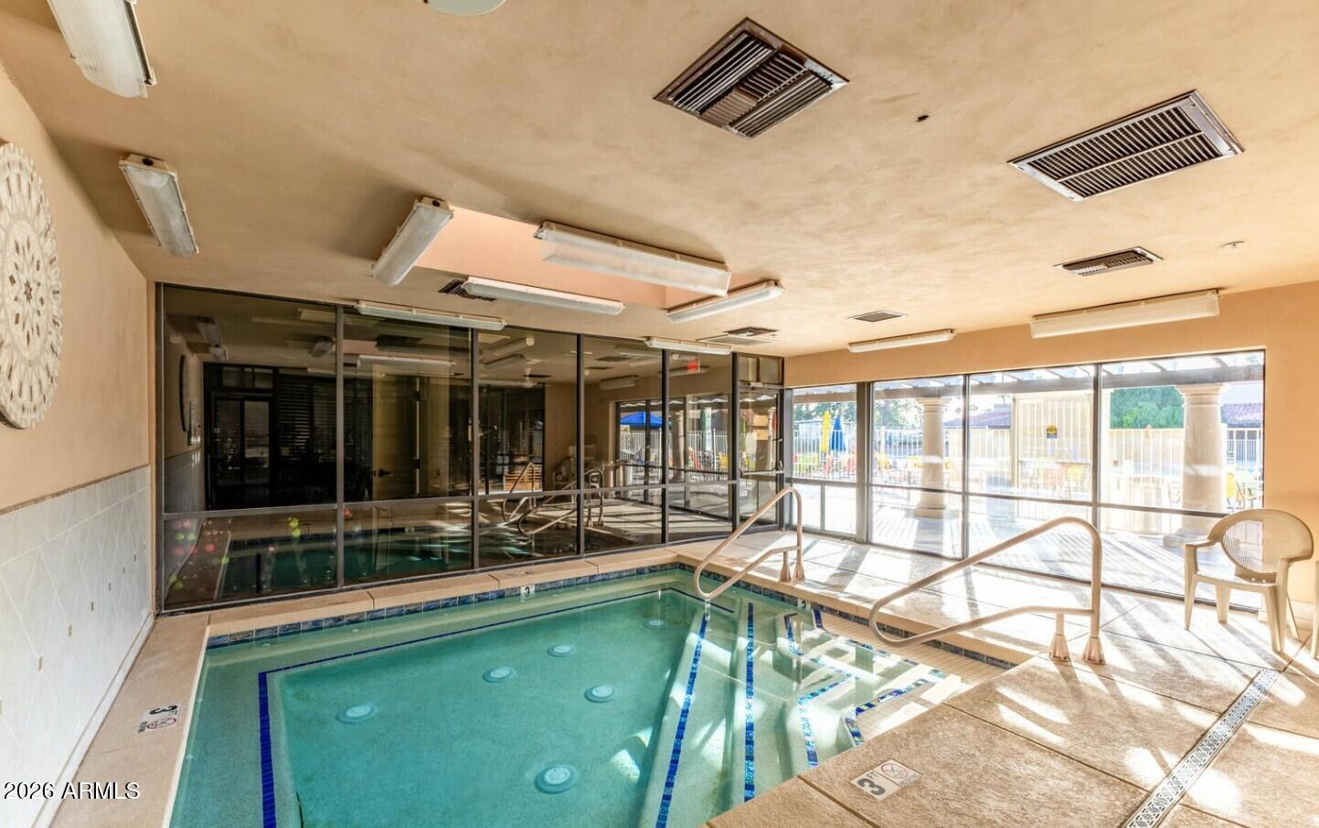 111 South Greenfield Road, Unit 90 Mesa, AZ 85206 - Photo 23 of 26 a view of a house with a large window and sitting area