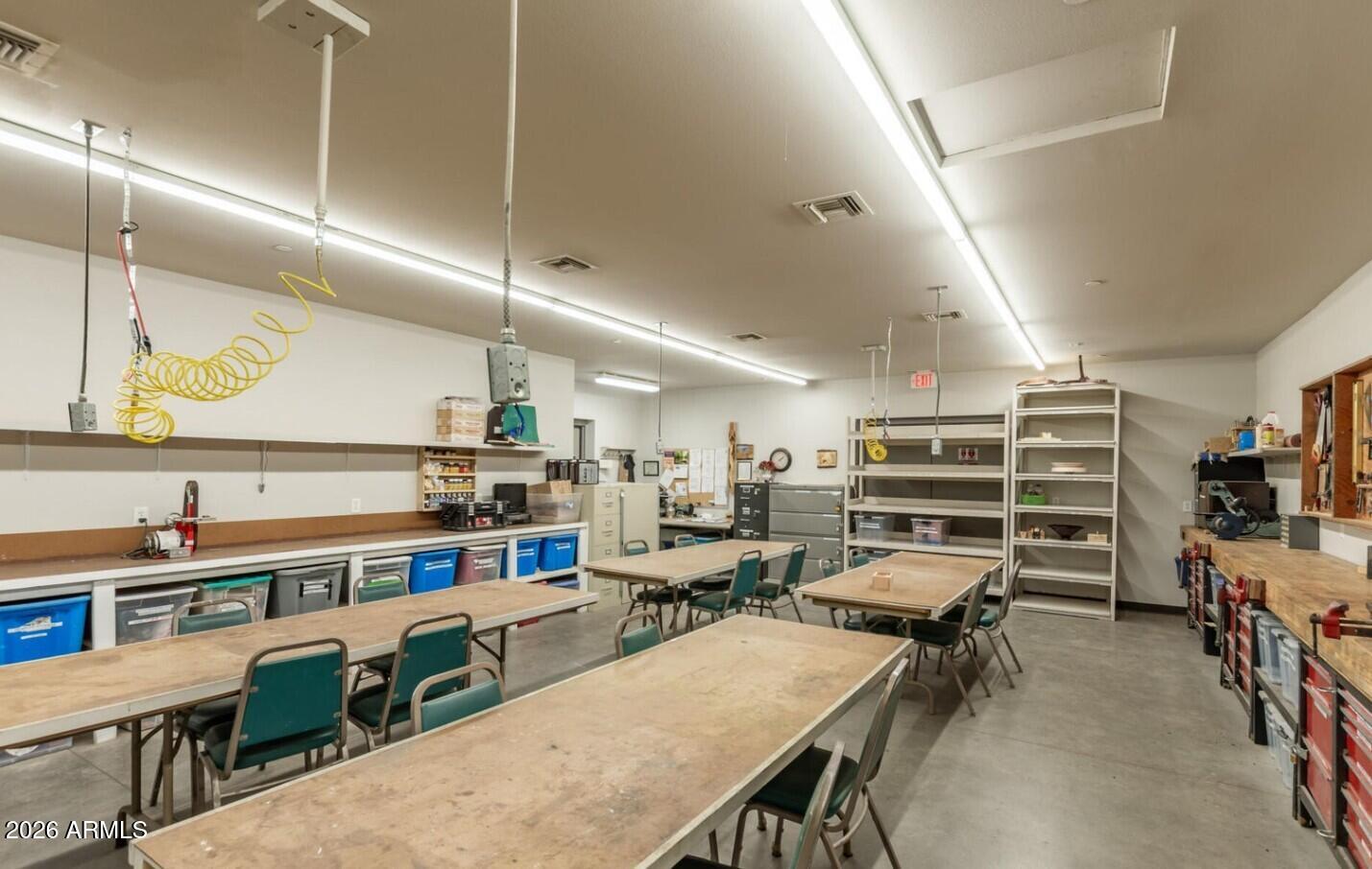 111 South Greenfield Road, Unit 90 Mesa, AZ 85206 - Photo 25 of 26 a room with furniture a air conditioner pool table and chairs