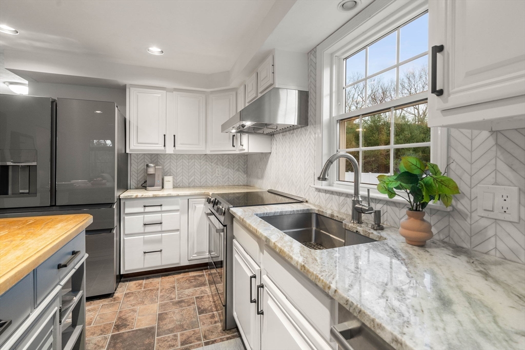 5 Cherry Brook Circle Sturbridge, MA 01566 - Photo 12 of 31 a kitchen that has a sink and a stove