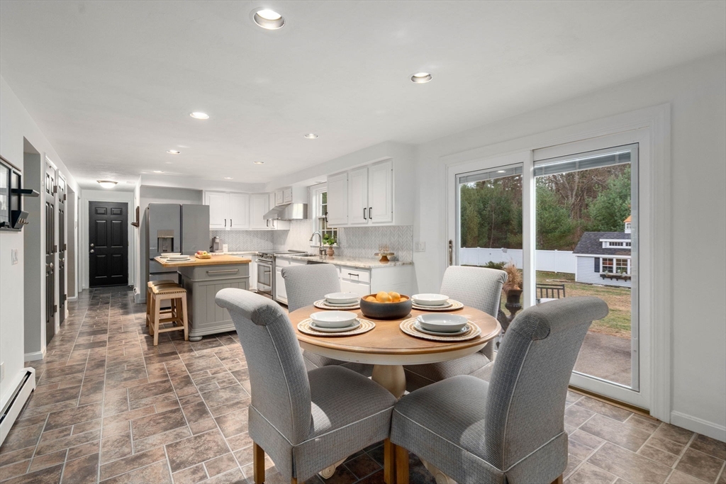 5 Cherry Brook Circle Sturbridge, MA 01566 - Photo 15 of 31 a dining room with stainless steel appliances a table and chairs