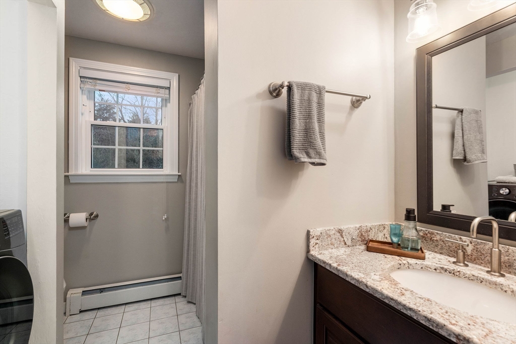 5 Cherry Brook Circle Sturbridge, MA 01566 - Photo 21 of 31 a bathroom with a granite countertop sink a mirror and shower