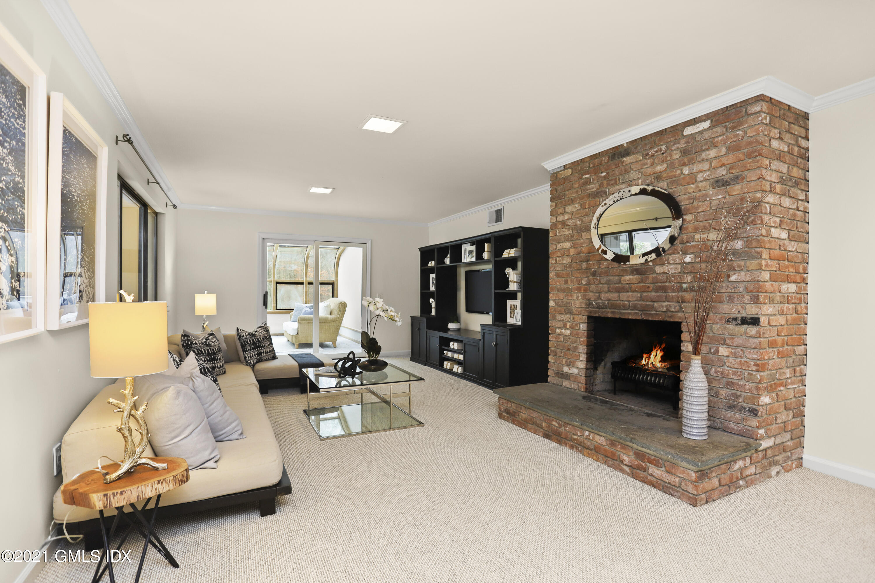 297 Cognewaugh Road Cos Cob, CT 06807 - Photo 15 of 25 a living room with furniture and a fireplace