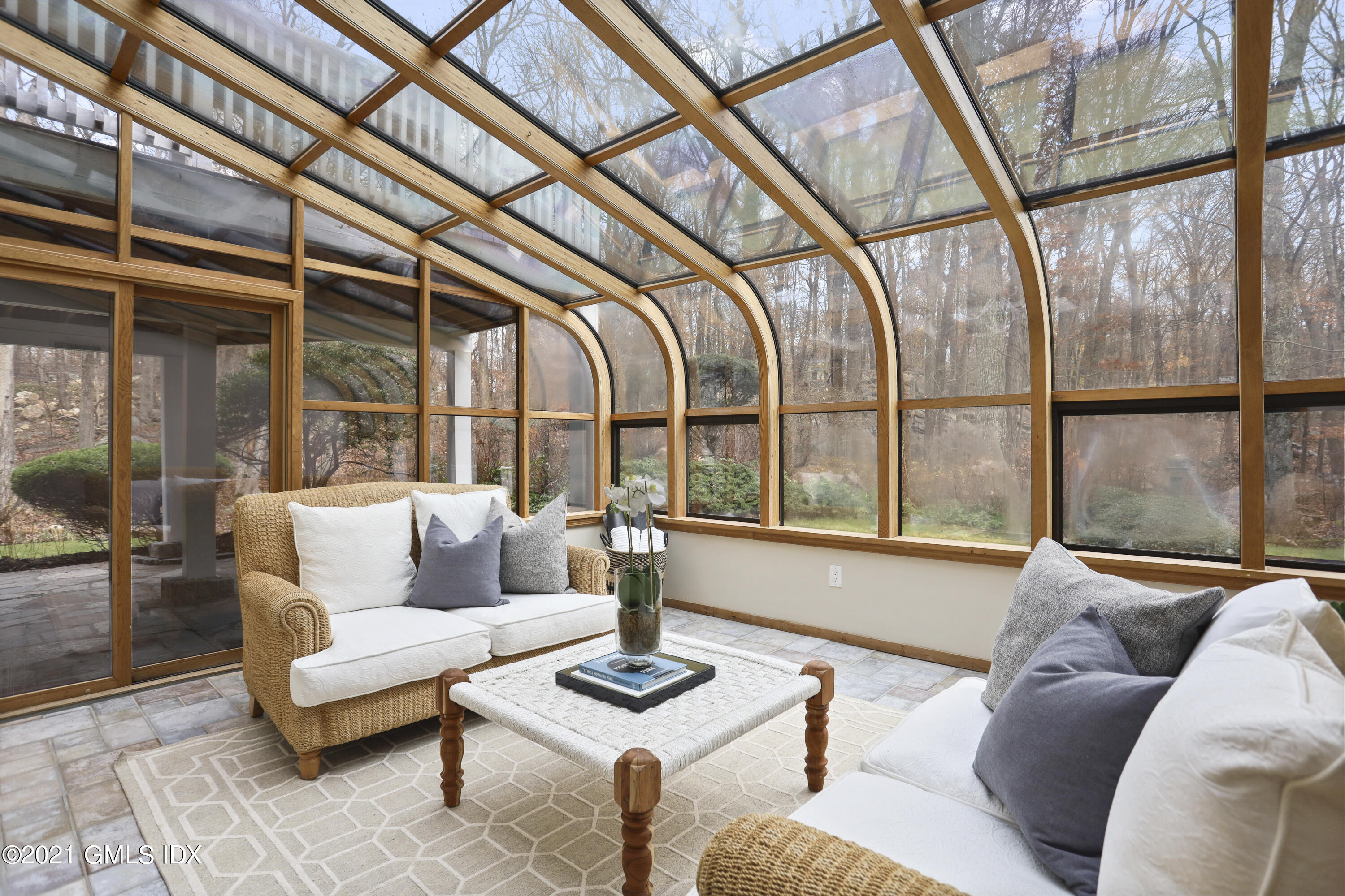 297 Cognewaugh Road Cos Cob, CT 06807 - Photo 17 of 25 a living room with furniture and a floor to ceiling windows