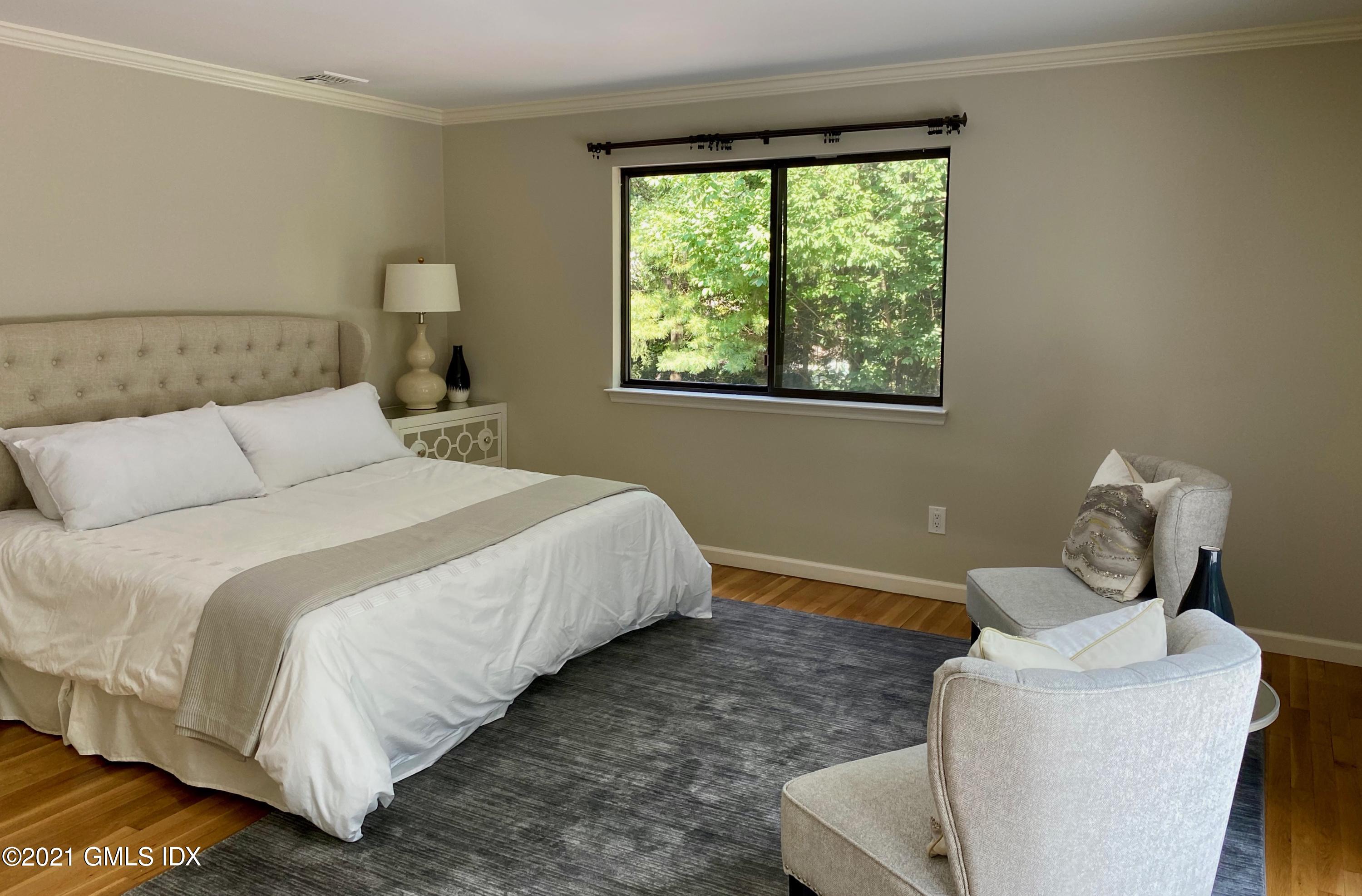 297 Cognewaugh Road Cos Cob, CT 06807 - Photo 9 of 25 a bedroom with bed and window