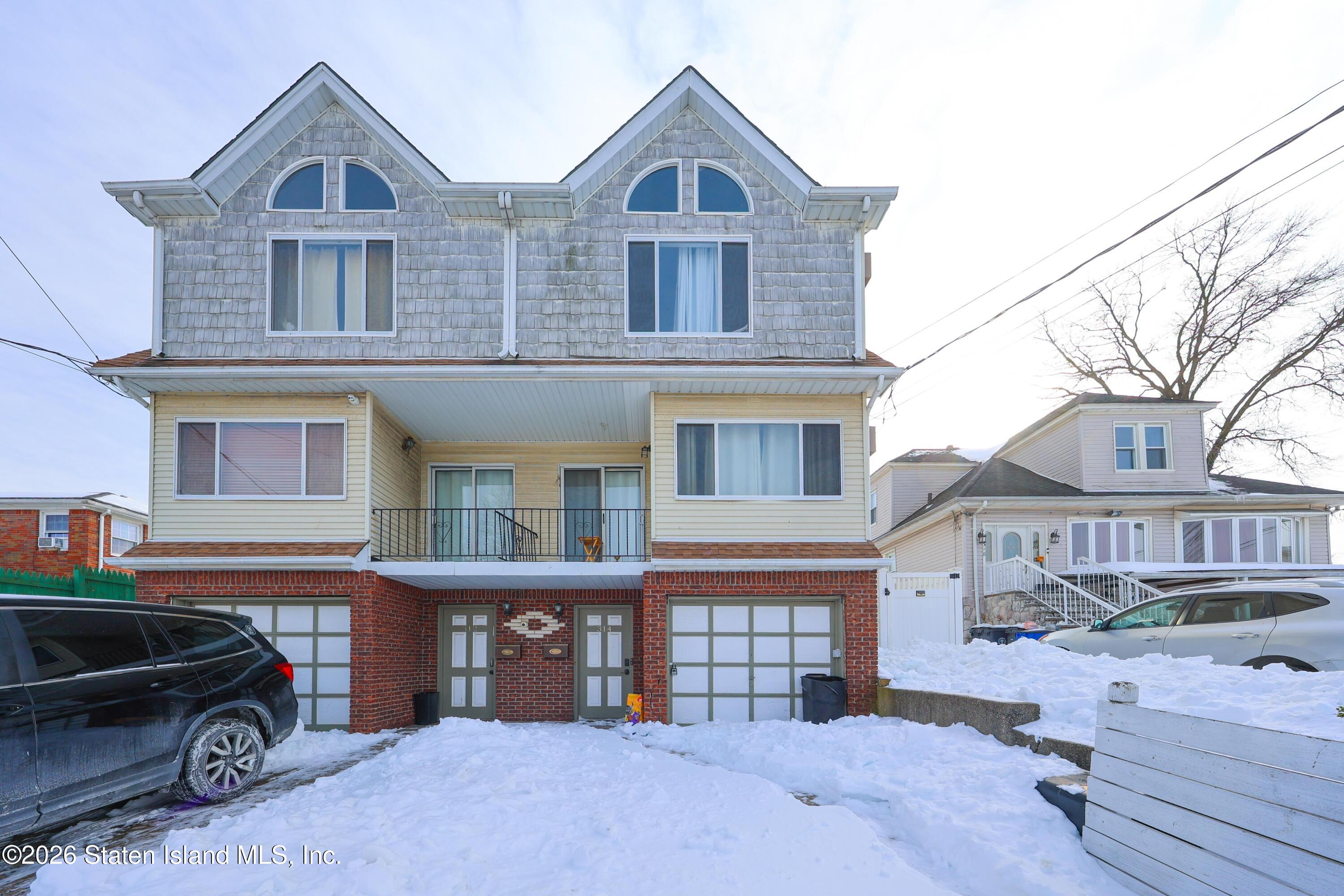 314 Harold Street Staten Island, NY 10314 - Photo 1 of 24 a front view of a house with parking space
