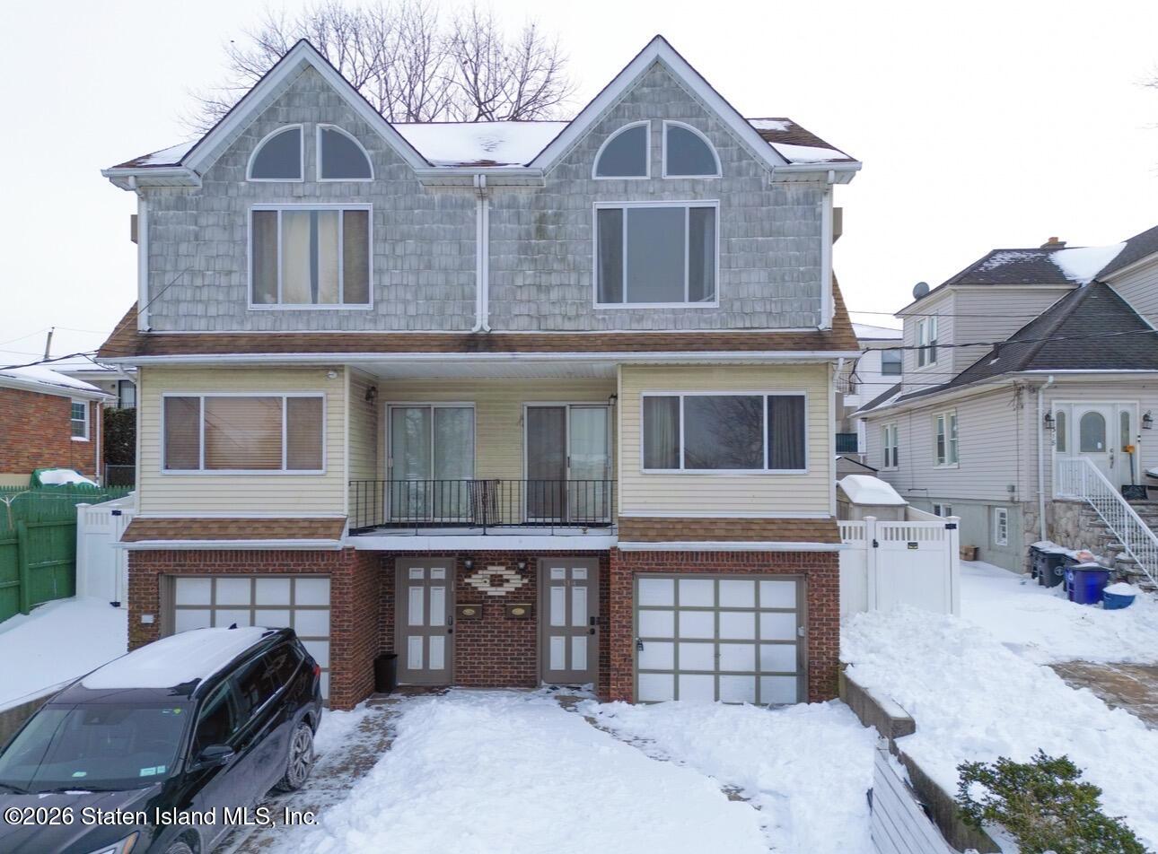 314 Harold Street Staten Island, NY 10314 - Photo 2 of 24 a front view of a house with a yard
